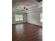 Bedroom featuring a tray ceiling, a ceiling fan and lots of natural light at 5890 Crowley Dr, Douglasville, GA 30135