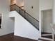 New home staircase featuring stained wood and painted risers and stringers at 5890 Crowley Dr, Douglasville, GA 30135