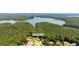 Beautiful aerial view showcasing the lush landscaping and lake views surrounding the community at 619 Lovinggood Trl, Woodstock, GA 30189