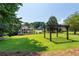 The expansive backyard features a pergola and lots of space for outdoor activities at 619 Lovinggood Trl, Woodstock, GA 30189
