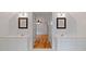 Dual sink bathroom with white cabinetry and framed mirrors at 619 Lovinggood Trl, Woodstock, GA 30189