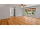 Bright bedroom features hardwood floors, neutral walls, and natural light at 619 Lovinggood Trl, Woodstock, GA 30189