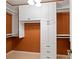 Custom closet featuring built-in storage with drawers, cabinets, and hanging racks at 619 Lovinggood Trl, Woodstock, GA 30189