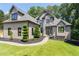 Beautiful home with well-manicured lawn and mature landscaping at 619 Lovinggood Trl, Woodstock, GA 30189