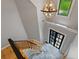 Bright two-story foyer features a modern chandelier, staircase, and tiled floor at 619 Lovinggood Trl, Woodstock, GA 30189