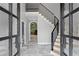 Grand two story foyer featuring stairs with wrought iron railing at 619 Lovinggood Trl, Woodstock, GA 30189