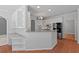 Bright kitchen with stainless steel appliances and views of sunroom and breakfast nook at 619 Lovinggood Trl, Woodstock, GA 30189