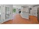 Open kitchen features white cabinets, breakfast bar and stainless appliances at 619 Lovinggood Trl, Woodstock, GA 30189