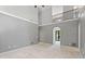 Open concept living room with tall ceilings, fireplace, and lots of natural light at 619 Lovinggood Trl, Woodstock, GA 30189