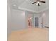Large primary bedroom with tray ceiling, ceiling fan and ensuite bath at 619 Lovinggood Trl, Woodstock, GA 30189