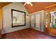 Comfortable sunroom with wooden floors and a view to the outside at 619 Lovinggood Trl, Woodstock, GA 30189