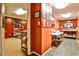 Large, multipurpose basement room with tables, tile flooring, and adjacent room at 10575 Tuxford Dr, Alpharetta, GA 30022