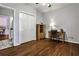 Bright bedroom with hardwood floors, a closet, and a desk area for work or study at 10575 Tuxford Dr, Alpharetta, GA 30022