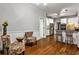 Open kitchen with breakfast bar, stainless appliances, and hardwood floors at 10575 Tuxford Dr, Alpharetta, GA 30022