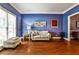Stylish living room features a comfortable sofa, hardwood floors, and ample natural light at 10575 Tuxford Dr, Alpharetta, GA 30022