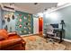 A unique office with built in display shelving, artistic hanging pendants, and an oversized area rug at 10575 Tuxford Dr, Alpharetta, GA 30022