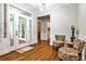 Bright sunroom with hardwood floors, large windows, and access to the outdoors at 10575 Tuxford Dr, Alpharetta, GA 30022