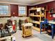 Spacious crafting workshop with natural light, ample storage, and specialized equipment at 10575 Tuxford Dr, Alpharetta, GA 30022