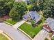 Aerial view of a beautiful home showcasing its landscaped yard, stone accents, and architectural details at 1125 Fairview Club Cir, Dacula, GA 30019
