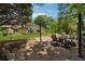 Inviting backyard with a gazebo, stone fire pit, and manicured lawn at 1125 Fairview Club Cir, Dacula, GA 30019