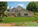 Expansive backyard featuring a well-manicured lawn, patio area, and siding exterior at 1125 Fairview Club Cir, Dacula, GA 30019