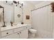 Bathroom featuring white cabinets, tiled floors, tub, and vanity at 1125 Fairview Club Cir, Dacula, GA 30019
