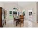 Bright dining area with tile floors, large window, and access to the backyard at 1125 Fairview Club Cir, Dacula, GA 30019