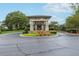 Elegant community center entrance with manicured landscaping and a welcoming circular driveway at 1125 Fairview Club Cir, Dacula, GA 30019