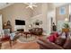 Cozy living room with fireplace, hardwood floors, and bright natural light at 1125 Fairview Club Cir, Dacula, GA 30019
