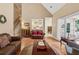 Inviting living room with hardwood floors, neutral walls, and a view into the kitchen at 1125 Fairview Club Cir, Dacula, GA 30019
