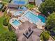 Birds eye view of an amazing swimming pool and lounge area with water slides and splash pads at 1125 Fairview Club Cir, Dacula, GA 30019