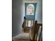 Bright foyer with a tall window and staircase, offering a grand entrance to the home at 1441 Saint George Pl, Conyers, GA 30012