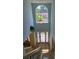 Entry foyer featuring a grand arched window for natural light at 1441 Saint George Pl, Conyers, GA 30012
