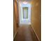 Spacious hallway with neutral carpeting leads to various rooms in the home at 1441 Saint George Pl, Conyers, GA 30012