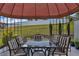 Outdoor patio area features patio furniture for relaxation and entertaining at 1441 Saint George Pl, Conyers, GA 30012