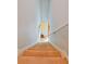 Carpeted staircase leading downstairs, providing a smooth transition between levels at 1441 Saint George Pl, Conyers, GA 30012