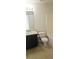 Well-lit bathroom with vanity, toilet, and shower-tub combo at 116 Ventura Trl, Stockbridge, GA 30281