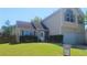 Charming two-story home with a well-manicured lawn and a two-car garage at 116 Ventura Trl, Stockbridge, GA 30281