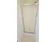 The shower is enclosed with a frosted glass door and has tile flooring at 116 Ventura Trl, Stockbridge, GA 30281