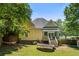 View of the house from a backyard with trampoline at 161 N Barton St, Norcross, GA 30071