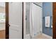 Bathroom with white walls, shower with curtain, and dark trim at 161 N Barton St, Norcross, GA 30071