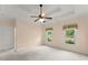 Bedroom with tray ceilings and a view to the backyard at 2323 Blackberry Ct, Snellville, GA 30078