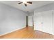 Bedroom features hardwood floors, ceiling fan, closet and ensuite bathroom at 2323 Blackberry Ct, Snellville, GA 30078