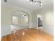 Bright dining room boasts hardwood floors, chair rail and views into other rooms at 2323 Blackberry Ct, Snellville, GA 30078