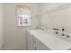 Bright laundry area featuring modern appliances and a storage rack at 2323 Blackberry Ct, Snellville, GA 30078