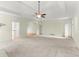 Bright, airy living room featuring a tray ceiling, fireplace and multiple doorways at 2323 Blackberry Ct, Snellville, GA 30078