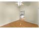 Bright living room featuring hardwood floors, a ceiling fan, and an open view to the kitchen at 2323 Blackberry Ct, Snellville, GA 30078