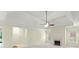 Spacious living room boasting a tray ceiling, fireplace, and bright, neutral decor at 2323 Blackberry Ct, Snellville, GA 30078