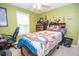 Fun bedroom with ceiling fan, window, and fun Mario decor at 241 Lost Lake Way, Villa Rica, GA 30180