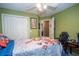 Cozy bedroom with a ceiling fan, a closet, and adjacent room at 241 Lost Lake Way, Villa Rica, GA 30180